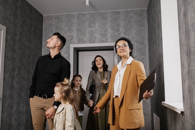 Five people viewing a house